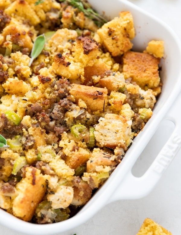 cornbread stuffing in a white baking dish