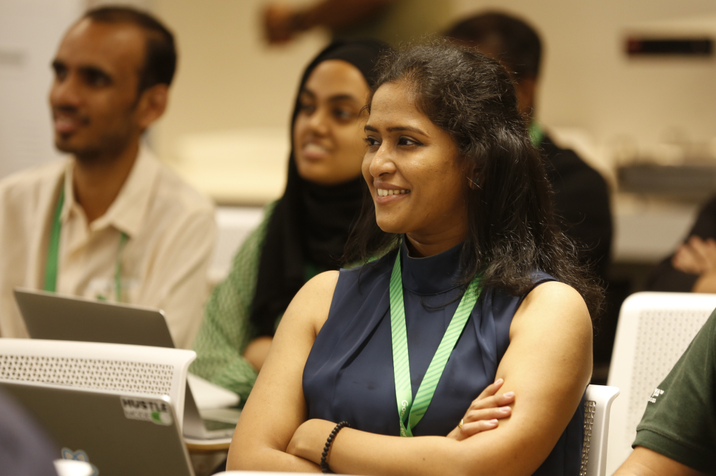 Group of people listening to something while smiling