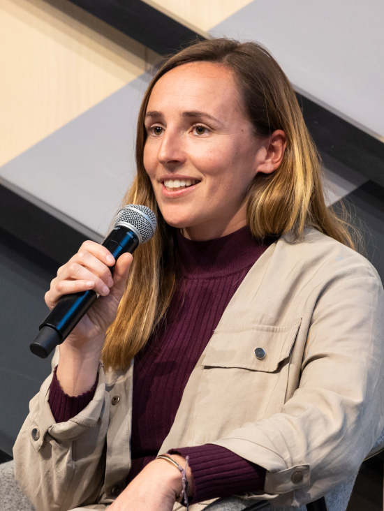 Women speaking on microphone