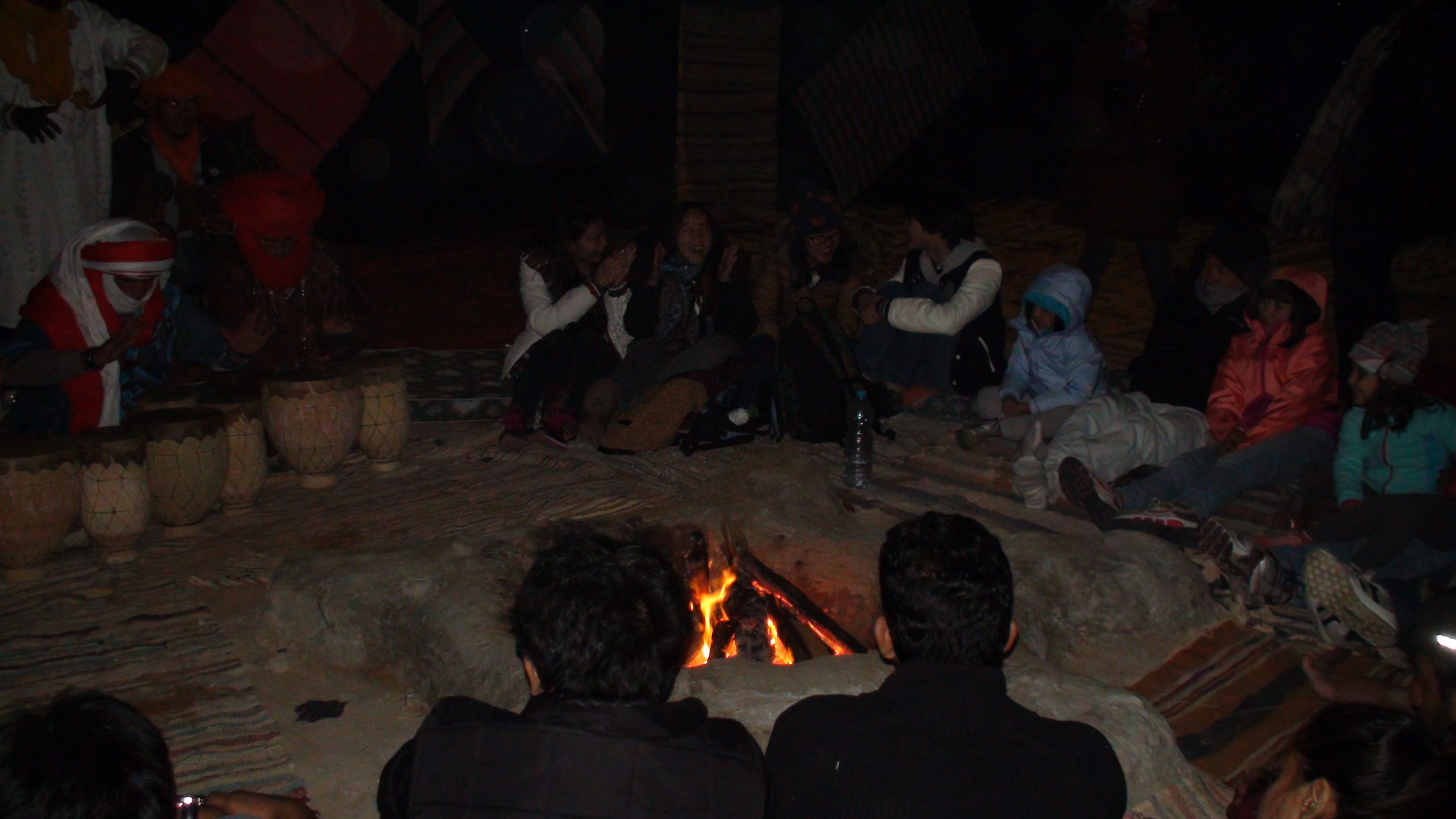 sitting around the camp fire in the sahara desert