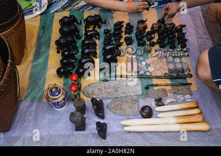 Top view of hand-crafted wooden elephant sculptures sold as souvenirs in Luang Prabang, Laos Stock Photo