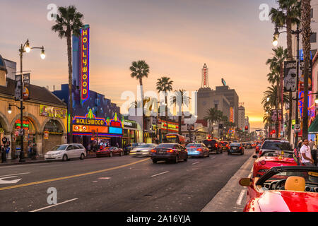 LOS ANGELES, CALIFORNIA - MARCH 1, 2016: Traffic on Hollywood Boulevard at dusk. The theater district is famous tourist attraction. Stock Photo