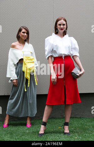 Models pose for a photo outside of the Fendi Fashion show in occasion of the Milan Fashion Week Spring - Summer 2020 Stock Photo