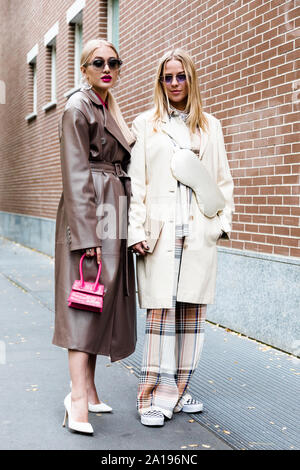 Models pose for a photo outside of the Fendi Fashion show in occasion of the Milan Fashion Week Spring - Summer 2020 Stock Photo