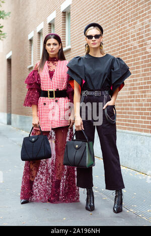 Models pose for a photo outside of the Fendi Fashion show in occasion of the Milan Fashion Week Spring - Summer 2020 Stock Photo