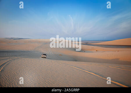 Mercedes G500 Silver Color close side view dunes bashing inland sea Doha Qatar Stock Photo