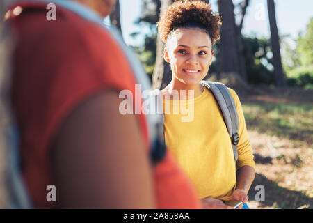 Smiling young woman hiking Stock Photo