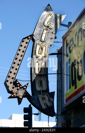 Old illuminated advertising of a liquor store on the Sunset Strip in West Hollywood, Los Angeles, California, USA Stock Photo