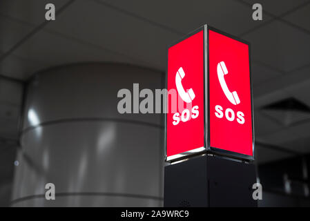 SOS emergency call information signs installed in public facilities. Stock Photo