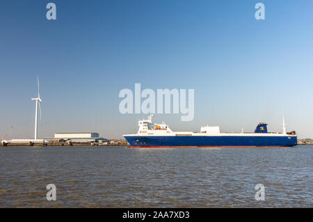 Gravesend, England, UK - September 21, 2010: A roll on-roll off cargo ferry sails on the Thames Estuary at Tilbury Docks in Essex. Stock Photo