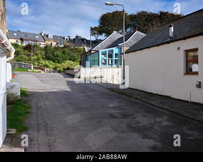 Looking up towards the Carnegie Hall off Main Street  at Portmahomack. Easter Ross. 26/09/19 Stock Photo