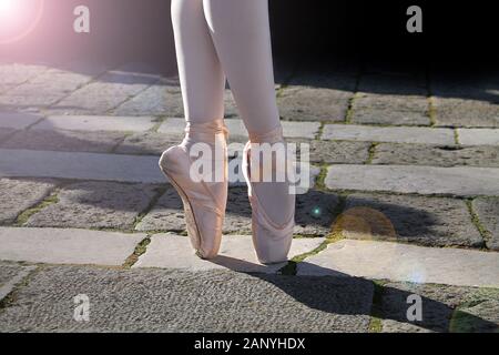 A ballet dancer performing a dance outdoor. Stock Photo