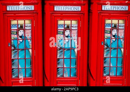 Red Telephone box, money box, London, England. Stock Photo