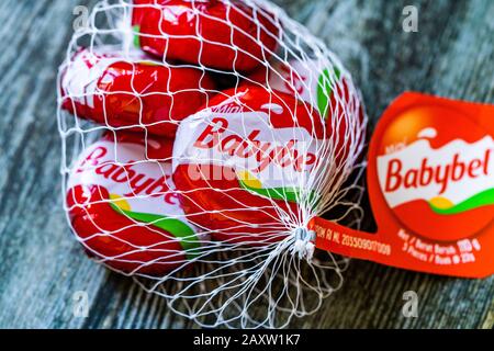 Istanbul, Turkey - February 23, 2018: Mini Babybel Cheese in Red Wax on Wooden Surface. Ready to Eat. Stock Photo