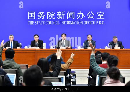 (200218) -- BEIJING, Feb. 18, 2020 (Xinhua) -- Photo taken on Feb. 18, 2020 shows a press conference held by the State Council Information Office in Beijing, capital of China. China's centrally-administered state-owned enterprises (SOEs) have taken active moves to combat the novel coronavirus disease (COVID-19). They contributed to hospital construction and medical material production and reinforced life and technological support, Ren Hongbin, vice chairman of the State-owned Assets Supervision and Administration Commission of the State Council, told a press conference Tuesday. (Xinhua/Li Xi Stock Photo