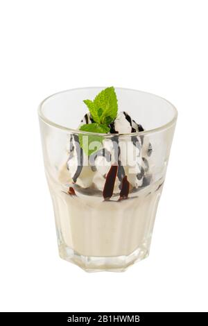 Panna cotta dessert with whipped cream, chocolate topping, isolated on a white background in grain glass with a taste of banana, vanilla, side view Stock Photo