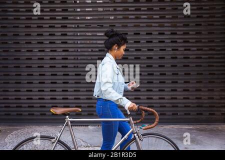 Woman walking in the street Stock Photo