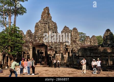 The magnificent Bayon Temple situated within the last capital city of the Khmer Empire - Angkor Thom. Its 54 gothic towers are decorated with 216 enormous smiling faces. Built in the late 12th or early 13th century as the official state temple of the King Jayavarman VII. Stock Photo