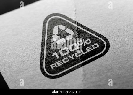 Recycle logo on recycled paper background. Stock Photo