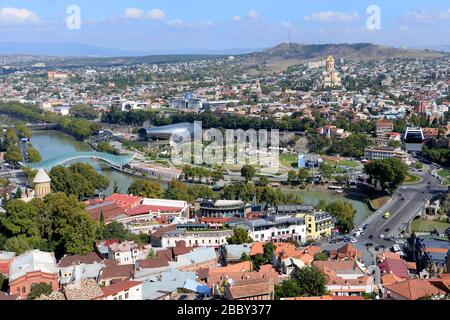 Tbilisi, Georgia overview. Modern landmarks of the city visible including the Bridge of Peace over Kura River, Rike Park and Presidential Palace. Stock Photo