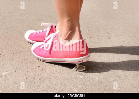 Foot stuck into chewing gum on street Stock Photo