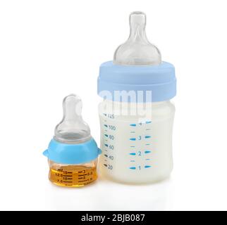 Feeding bottle with baby milk formula and bottle with medicine on white background Stock Photo