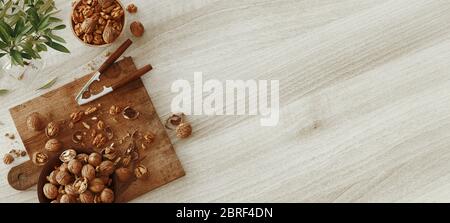 Mixed nuts on white wooden table from above. Healthy food and snack. Walnuts. 3d rendering Stock Photo