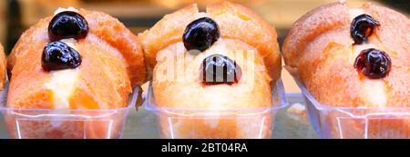 typical dessert of Naples City in Italy called BABA with cherries Stock Photo