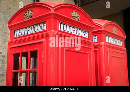 Red telephone box, Iconic british phone boxes or booths  in London, England, United Kingdom Stock Photo