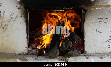 Countryside wood burning cook stove.Outdoor stone oven fireplace cooking preparing bbq and pizza Stock Photo