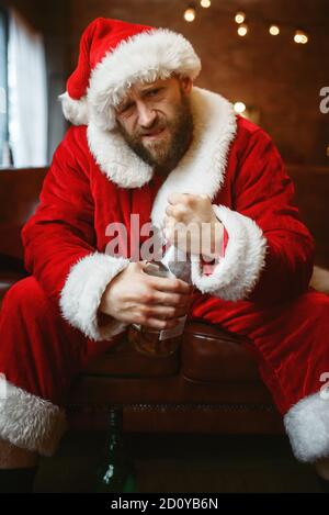 Bad Santa claus celebrate christmas with bottle Stock Photo