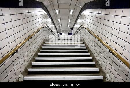 A deserted Leicester Square tube station the day after Prime Minister Boris Johnson ordered pubs, restaurants, leisure centres and gyms across the cou Stock Photo