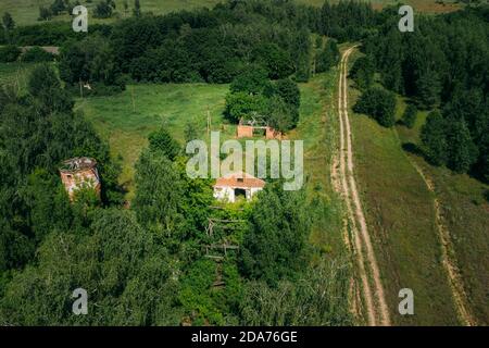 Belarus. Aerial View Of Ruined Cowshed In Chernobyl Zone. Chornobyl Catastrophe Disasters. Dilapidated House In Belarusian Village. Whole Villages Stock Photo