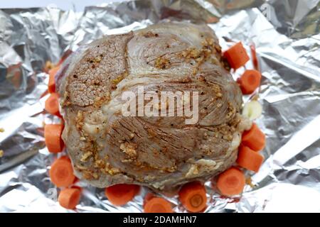 Marinated Beef Shank on foil in kitchen Stock Photo