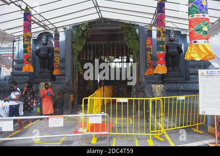 Temperature monitoring and QR code scanning at Sri Senpaga Vinayagar Temple, a Hindu Temple in Singapore, as part of Covid-19 control measures Stock Photo