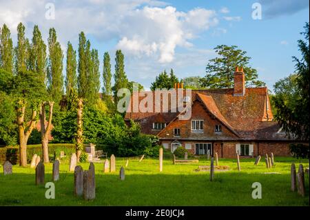 Looking across the graveyard of St Andrews church Farnham Stock Photo