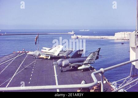 De Havilland Sea Vixen FAW1, XJ519, and Supermarine Scimitar F1, XD32?, on the flightdeck of HMS Ark Royal. Grand Harbour, Valletta, Malta. November 1960. Scanned from slide film. Stock Photo