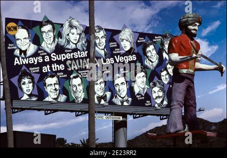 A billboard on the Sunset Strip in Los Angeles promotes travel to the Sahara Hotel in Las Vegas with Superstar performers circa 1979. Stock Photo