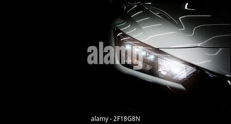 Modern car headlights on black background. Copy space Stock Photo