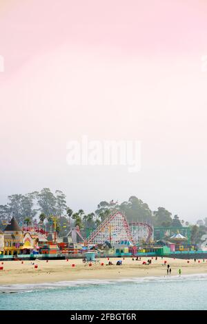 USA, California, Santa Cruz, Amusement park on sandy beach seen from Municipal Wharf Stock Photo