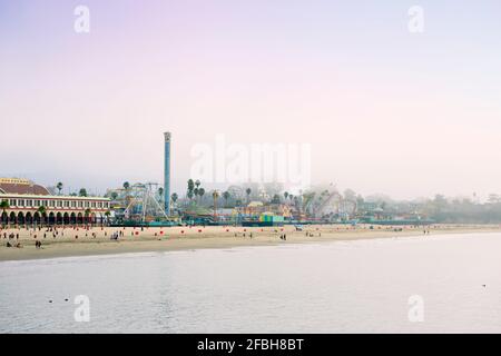 USA, California, Santa Cruz, Amusement park on sandy beach seen from Municipal Wharf Stock Photo