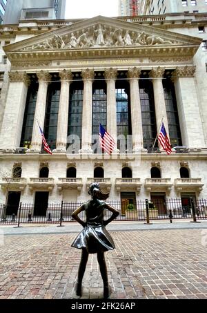 Fearless Girl bronze statue by Kristen Visbal in the financial district in lower Manhattan area of New York City, NY, USA Stock Photo