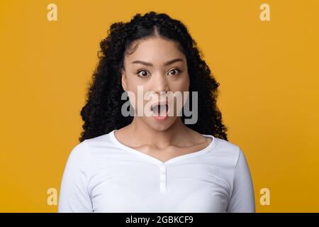 Oh No. Shocked African American Lady With Opened Mouth Looking At Camera Stock Photo