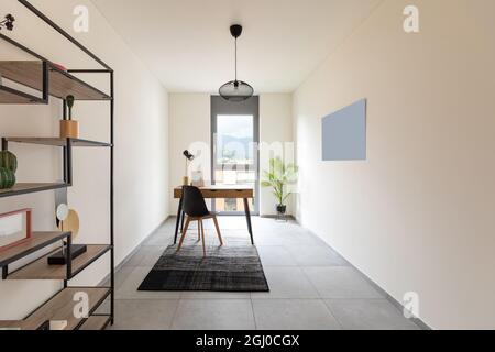 Interior study or home office with table and chair. Minimalist but nice decor. Stock Photo