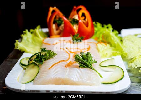 Grilled Salmon Garnished with Fruits and Vegetables. Stock Photo