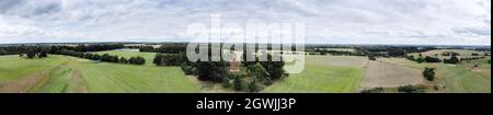 panoramic landscape image from above of The Bourbon Tower near stowe gardens set in the countryside of Buckingham in england. Was built as a house for Stock Photo