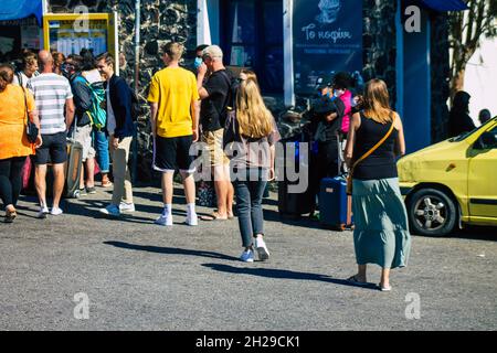 Santorini, Fira, Greece - October 20, 2021 Crowd of tourists at the bus station, all the buses depart and finish their routes,  6 destinations includi Stock Photo