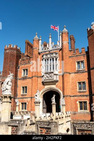 Hampton Court Palace flying Union Jack flag Richmond upon Thames Greater London Surrey UK  Hampton Court Palace on the banks of the River Thames Stock Photo