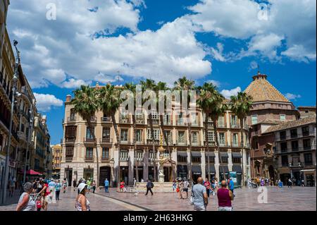 malaga,spain: constitution square (plaza de la constitucion) in european city center in andalusia region with palm trees,clear blue sky in warm sunny spring day. Stock Photo