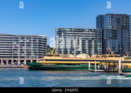 Bennelong apartment buildings at East Circular Quay as freshwater class ferry the MV Collaroy departs the ferry terminus,Sydney,Australia Stock Photo